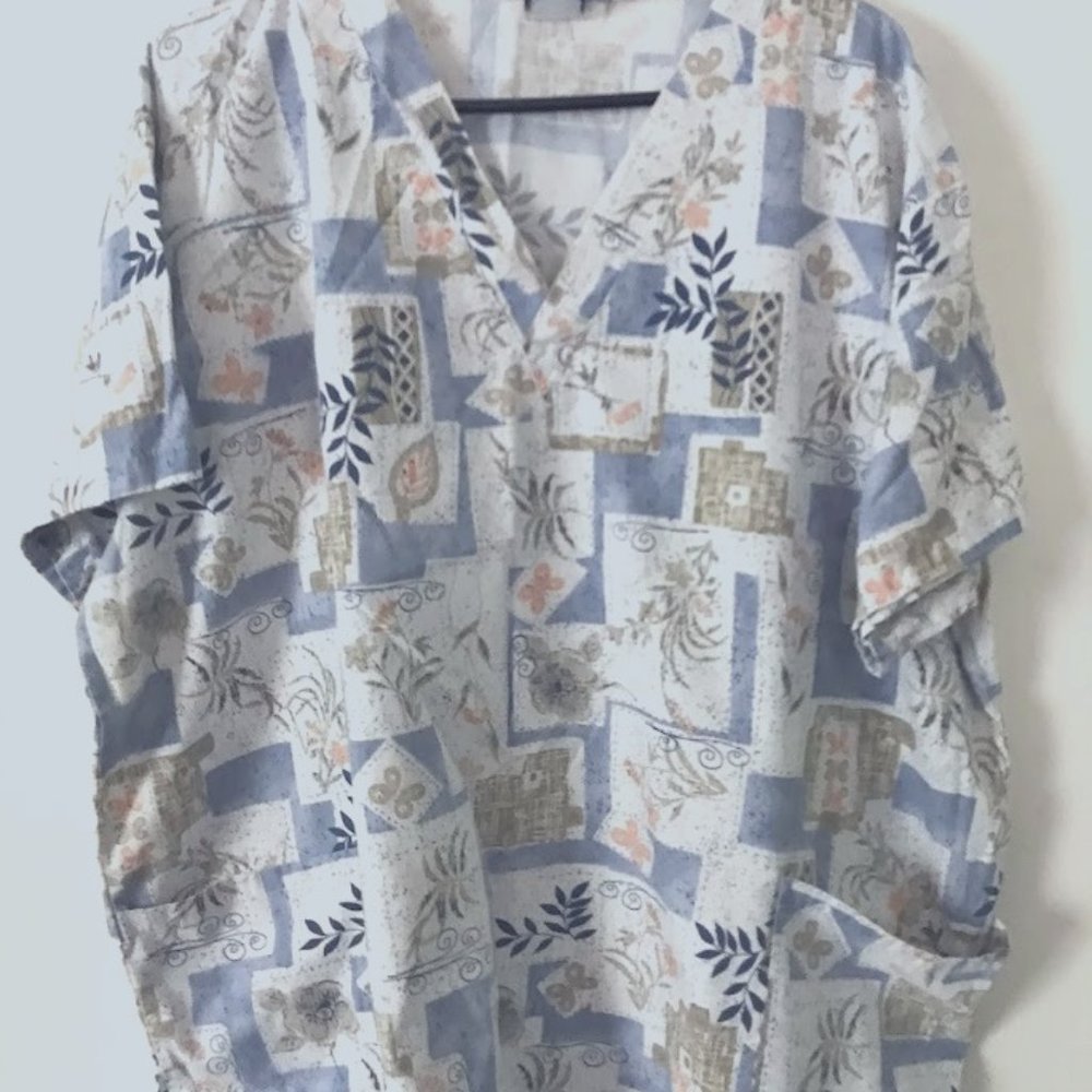 Dusty blue scrub top leaf and floral design